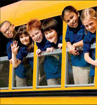 kids leaning out of bus